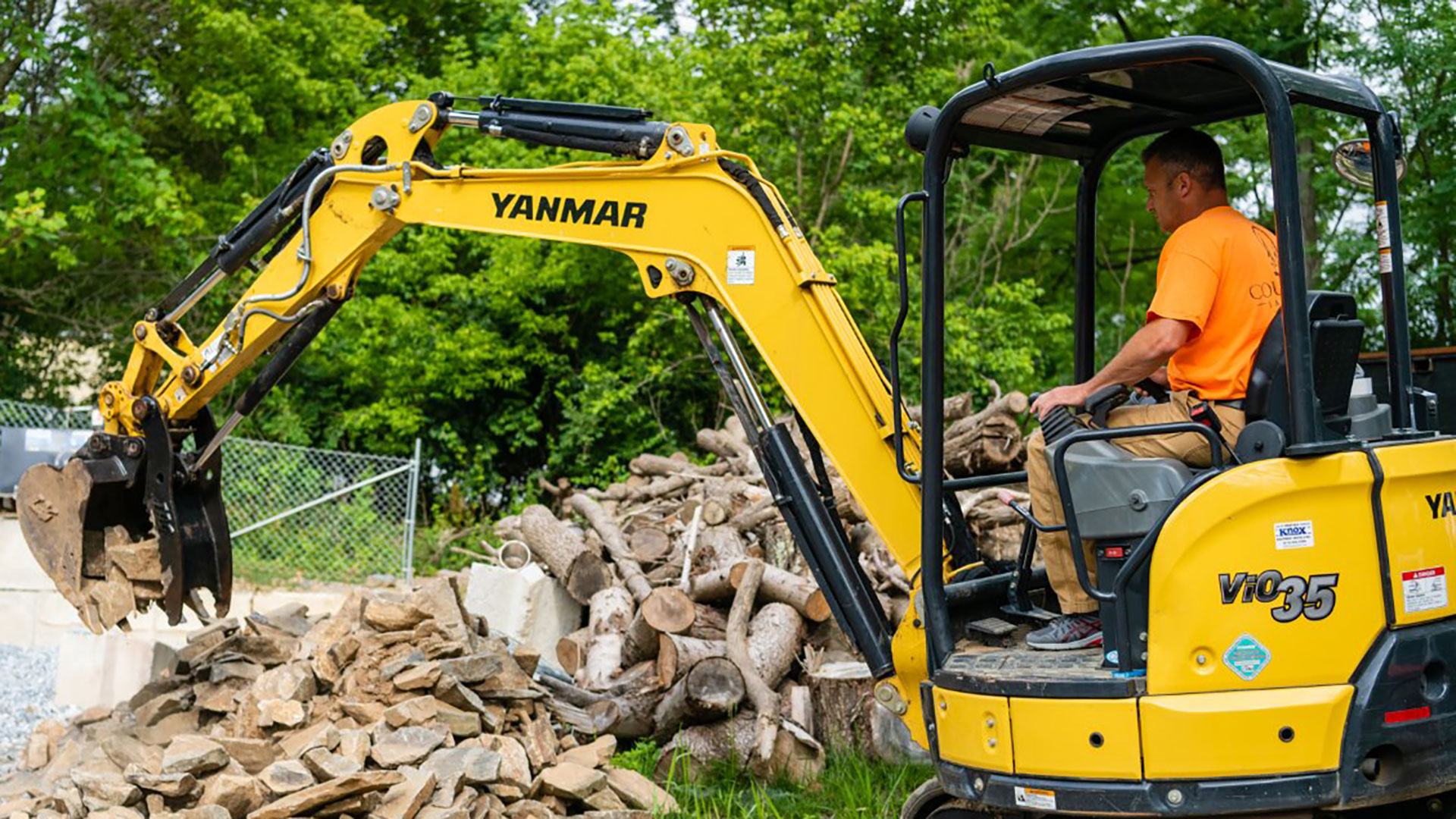 Our landscaper operating an excavator on a property in Downingtown, PA.
