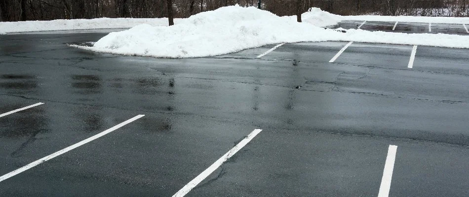 Cleared parking lot in West Chester, PA, with piles of snow.