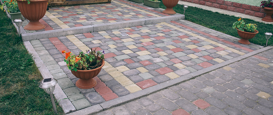 A colorful paved patio built by a home in Exton, PA.