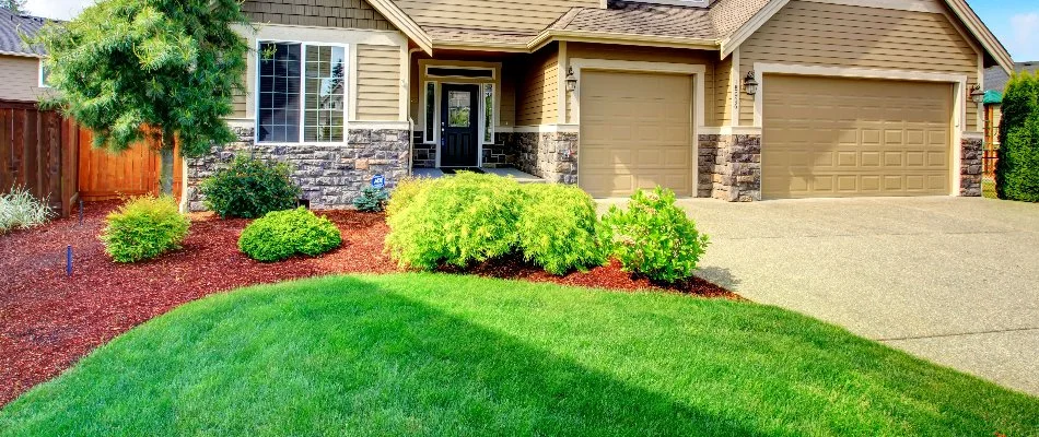 House in West Chester, PA, with neat landscaping and healthy green grass.