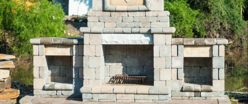 Outdoor fireplace in West Chester, PA, made from concrete pavers.