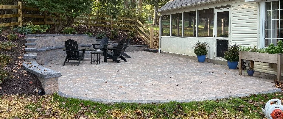 Patio in West Chester, PA, with fire pit and chairs.