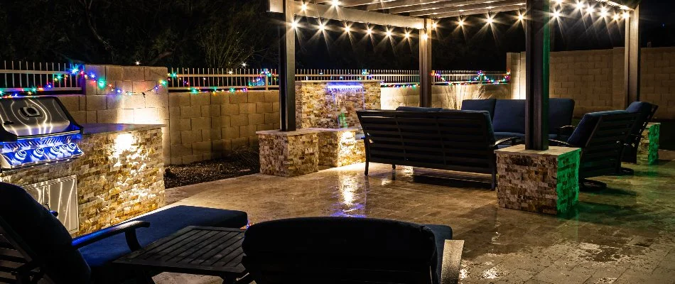 Patio in West Chester, PA, with lighting, seating, and a pergola.
