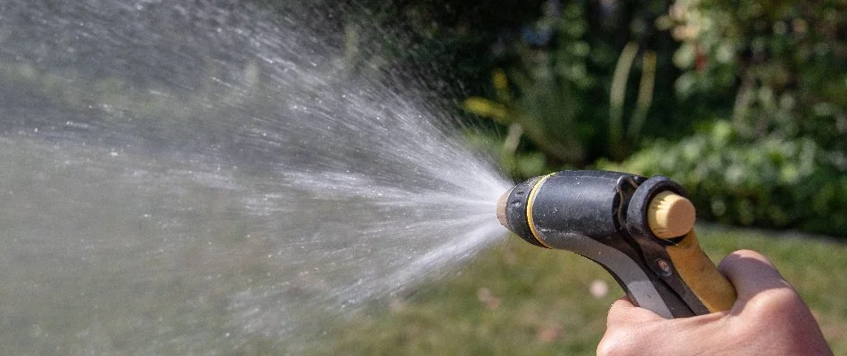 Spraying water on a lawn in West Chester, PA.