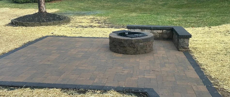 Square patio in West Chester, PA, with round fire pit.