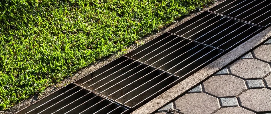 Stormwater basin in West Chester, PA, along grass and pavers.