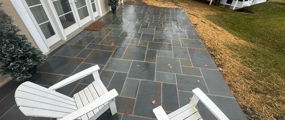 White chairs on a bluestone patio in West Chester, PA.