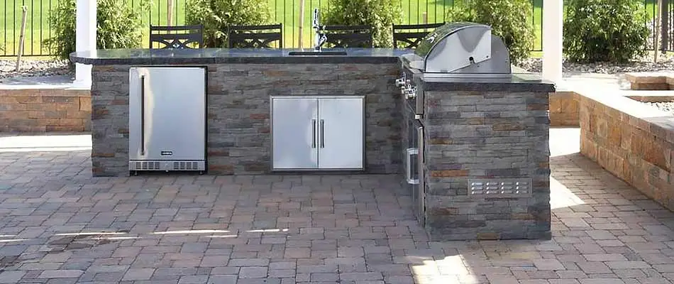 Custom stone outdoor kitchen living area in West Chester, Pennsylvania.