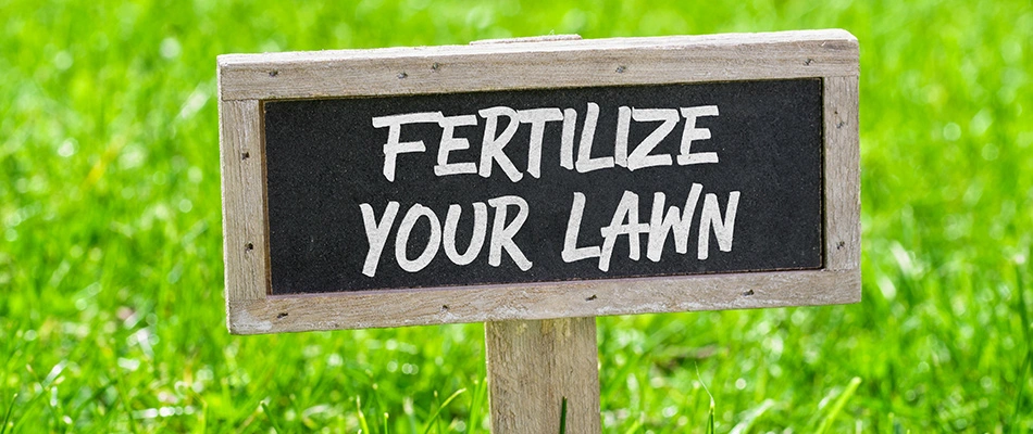 Fertilize your lawn sign in a green lawn near West Chester, PA.