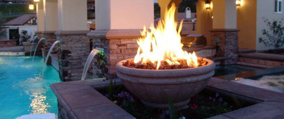 Fire pit and flames by a pool in Malvern, PA.