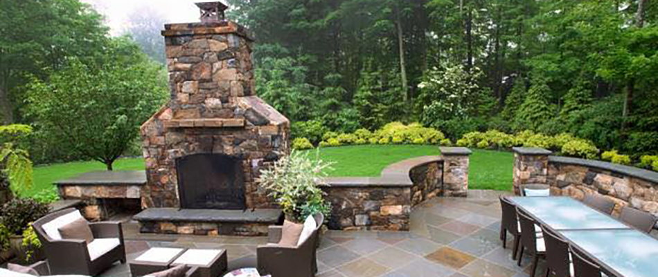 An outdoor fire place on a paved patio in Downingtown, PA.