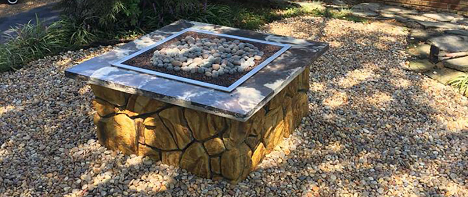 A stone firepit by a home in Exton, PA.