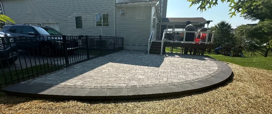 Paver patio with black border in West Chester, PA.