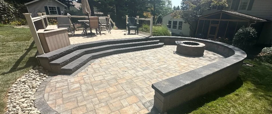 Seating wall around a patio with fire pit in Wayne, PA.
