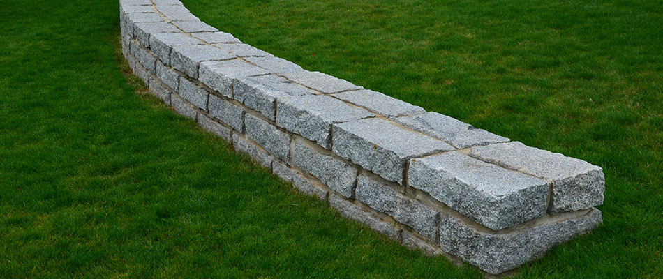 A free standing stone seating wall built in our client's backyard in Exton, PA. 